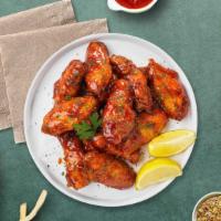 Sweet Blazing Bbq Wings · Fresh chicken wings fried until golden brown, and tossed in honey and barbecue sauce. Served...