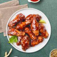 Blazing Bbq Wings · Fresh chicken wings fried until golden brown, and tossed in barbecue sauce. Served with a si...