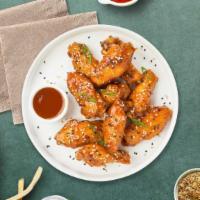Sweetie And Soury Wings · Fresh chicken wings fried until golden brown, and tossed in sweet and sour sauce. Served wit...