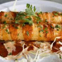 Lobster Taquitos · Drilled with Awesome Sauce, rolled in a flour tortilla