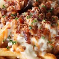 Chowder Fries · Natural-cut fries smothered in creamy clam chowder & bacon