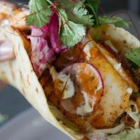 Ultimate Fish Taco · Giant fish taco (grilled or crispy) w/cabbage, awesome sauce, pickled onion on top.