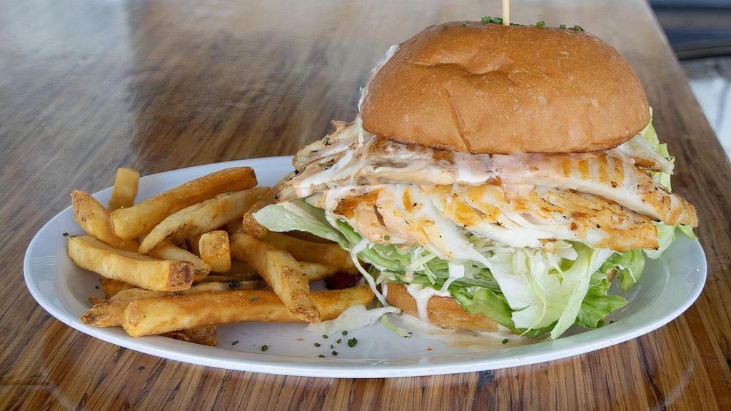 Reel Fish Sandwich · Traditional made with grilled Cobia, lettuce, tomato, cabbage. Choose your sauce, or pick another daily fish.