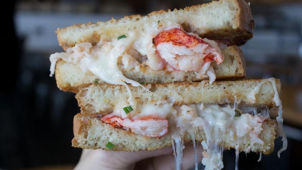 Clobster Grilled Cheese · Melting mix of lobster, crab, & a creamy herb sauce. Comes with one side of awesome sauce too.