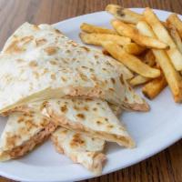 Kids Salmon Quesadilla · Grilled salmon packed into a flour shell with melted cheese