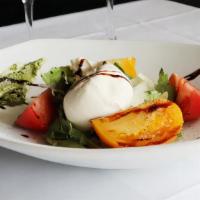 Heirloom Tomato Salad · Fresh heirloom tomato tossed with extra virgin olive oil, burrata cheese, pesto and finished...