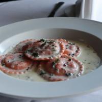 Butternut Squash Ravioli · Sage brown butter sauce with a touch of cream.