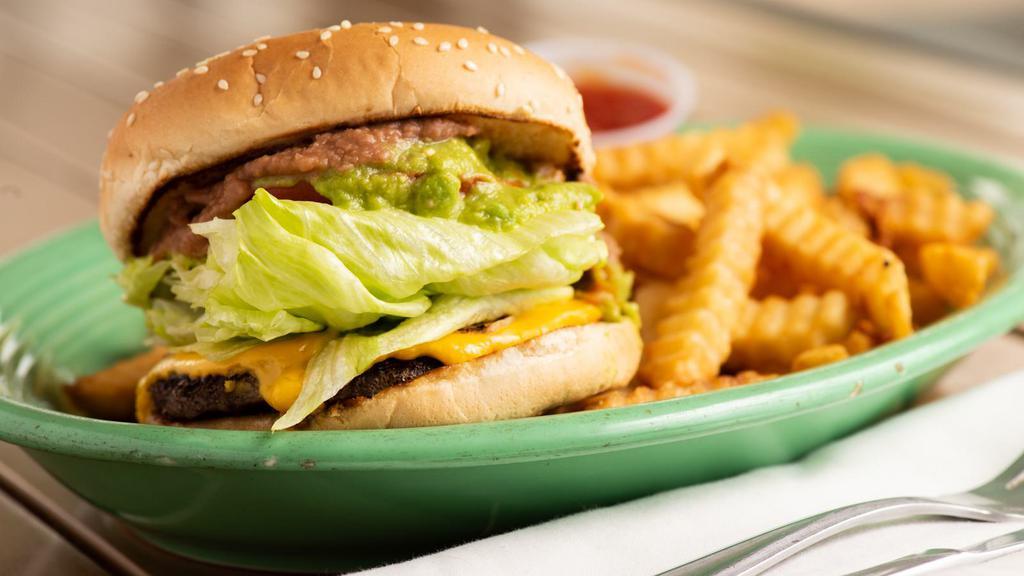 Azteca Burger · One patty, cheese, onions, tomatoes, lettuce, guacamole, jalapeños, chipotle sauce, beans and mayonnaise.