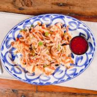 Crispy Calamari · Sweet and spicy chili sauce, green onion, cilantro.