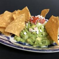 Traditional Guacamole & Chips · Made fresh daily in our kitchen.