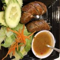 Lao Sausage (2 Pieces) · Halal. Chicken with lemongrass and lime kaffir lime leaves.