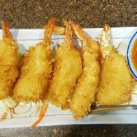 Coconut Shrimp · Deep fried shrimp battered with coconut flake served with sweet and sour sauce.