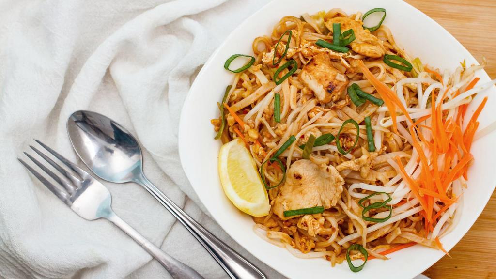 Pad Thai · Halal. Choice of vegetarian or meat stir fried rice noodles, tofu, bean sprouts, green onions, and eggs in sweet and sour tamarind sauce topped with crushed peanut.