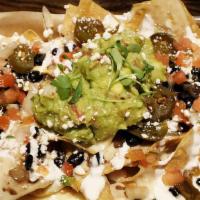 Flastick Nachos Small · Small Portion: Sauces and toppings come on the side to keep your chips fresh and crunchy dur...