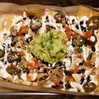 Flastick Nachos Large · Large Portion:
Sauces and toppings come on the side to keep your chips fresh and crunchy dur...