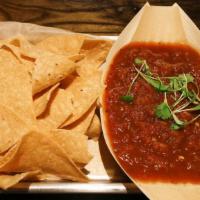 Chips + Salsa · House-made salsa paired with locally made chips. Chips and salsa are both gluten free and ve...