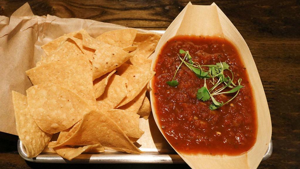 Chips + Salsa · House-made salsa paired with locally made chips. Chips and salsa are both gluten free and vegan.