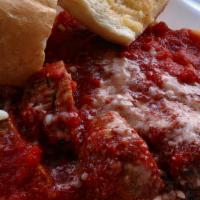 Spaghetti And Meatballs · Served with garlic bread.