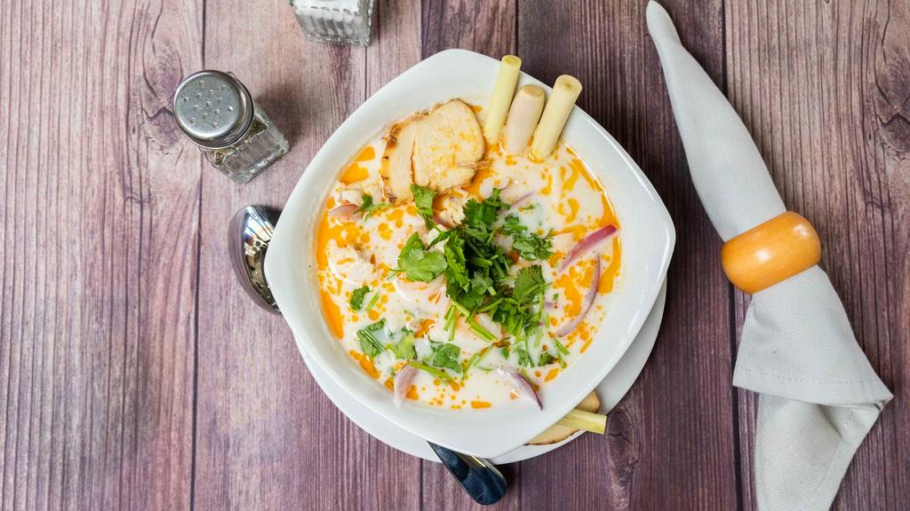 Tom Kha (Coconut Soup) · Coconut soup, lemongrass, lime leaves, bell peppers, mushrooms, onions & cilantro.