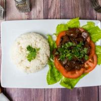 Lok Lak (Cambodian Beef Stir-Fried) · Garlic, stir-fried with seasoned beef pour on the top of slice onions & tomatoes, (add fried...