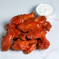 12 Wings · Twelve  jumbo wings tossed in our signature buffalo sauce with large ranch on the side