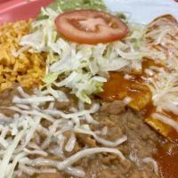 Enchiladas · Rice, beans, sour cream, guacamole, tomatoes and tortillas.