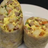 Breakfast Burrito · Made with eggs, Potatoes, cheese, pico de gallo, and mild salsa. Choice of bacon, ham, sausa...