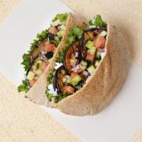 Grilled Eggplant Pita Sandwich · Wrapped in a pita with lettuce, cucumber, tomato, and your choice of sauce.