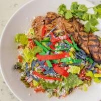 Steak Salad · NY steak, romaine lettuce, poblano peppers, cilantro, chopped tomatoes, red onions, topped w...