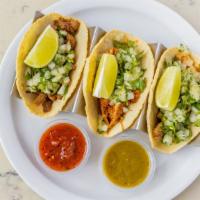 Tacos Vegetarianos · Roasted vegetables, queso fresco, and tomatillo salsa side of black beans.