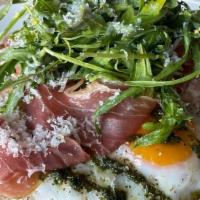 Crispy Sunny Eggs With Prosciutto · prosciutto, parmesan, arugula, pesto