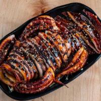 Grilled Whole Squid · A crowd favorite! Grilled squid topped with our homemade sweet and spicy sauce and toasted s...