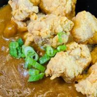 Chicken Karaage Curry · Chicken Karaage over rice with Japanese style curry, topped with green onions.