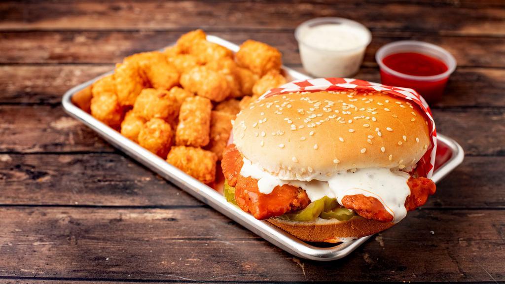 Buffalo Chicken Sandwich Combo · crispy breaded chicken tossed in buffalo sauce, with ranch and pickles on a toasted sesame bun choice of side, dipping sauce, and drink