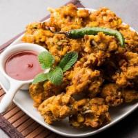 Vegetable Pakora · Fresh vegetables dipped in a special batter and fried to golden perfection