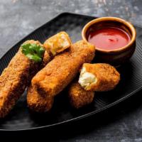 Stuffed Paneer Pakora · Homemade Indian cheese cubes stuffed with Chef's special recipe and fried to golden perfecti...