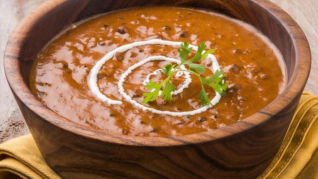 Dal Makhani · Black lentils, simmered overnight, finished with garlic tomato butter sauce