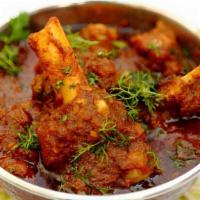 Lamb Curry · Boneless pieces of lamb cooked in mild curry.