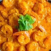 Jhinga Malai Curry · Tiger prawns, simmered in coconut & cream sauce.
