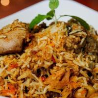 India Oven Dum Biryani · the meat is marinated and cooked along with short grain and fine rice.