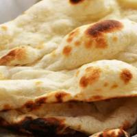 Butter Naan Rush · Punjabi style teardrop-shaped white bread baked on the sides of our tandoori oven.