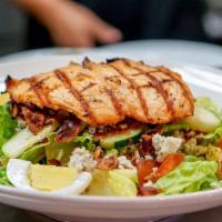 Cobb Salad · Romaine, grilled salmon, bacon, bleu cheese crumbles, tomatoes, cucumbers and hard boiled eg...