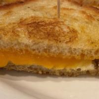 Grilled Cheese · Cheddar and jack cheese on garlic grilled sourdough.