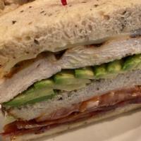 California Club · Grilled chicken breast, bacon, avocado, tomato, Swiss cheese and mayonnaise on toasted whole...