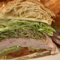 Turkey Avocado Croissant · Roasted turkey, avocado, tomatoes, lettuce, alfalfa sprouts, jack cheese and mayonnaise in a...