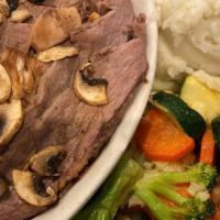 Brisket Of Beef · Tender slices of our hot and juicy beef brisket with grilled mushrooms and au jus. Served wi...