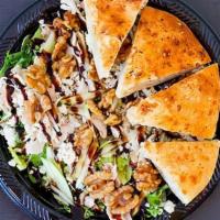Walnut And Green Apple Salad · Mixed greens, grilled chicken, blue cheese crumbles, green apples, candied walnuts, champagn...