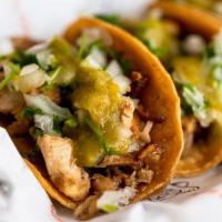 Street Taco · Two-three inches yellow corn tortillas, your choice of meat and salsa. Topped with onions, c...