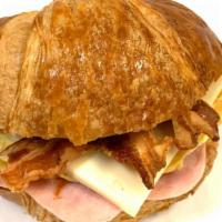 #1. Croissant With Ham, Egg, Bacon & Cheese · Ham, egg, bacon, cheese, mayo on a toasted croissant