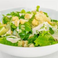 Caesar Salad · Crisp romaine lettuce with shaved parmesan, croutons, and caesar dressing.